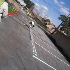 Professionally-Line-Striped-Parking-Spaces-and-Stenciling-at-an-Apartment-Complex-in-Riverside-California 0